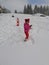 Child admiring the snow on the toboggan run