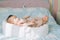 Child adoption and In Vitro Fertilization IVF . Asian child lying on the bed. Caring for newborn children