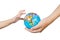 Child and Adult Holding a World Globe in Hands