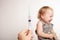 The child is afraid of a syringe, the girl yells and does not want to give an injection. Children`s fear of medical procedures. A