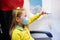 Child in airplane in face mask. Virus outbreak