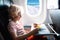 Child in airplane. Kids fly. Children flight meal