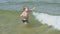 child alone in water waves sea ocean safety children on beach shore games