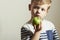 Child & apple.Little Boy with green apple.Health food.Fruits