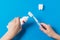 A child applies gel toothpaste to a silicone toothbrush.