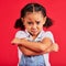 Child, arms crossed or sad portrait on isolated red background for depression, mental health or crying face. Upset