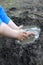 Child arms playing with mud, creating a pond with happiness