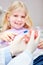 Child as patient learns to brush teeth at the dentist