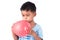 child asian little boy blowing balloon