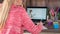 A child attends an online school during quarantine