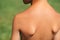 Child back tanned on nature, close up. Skin care. Healthy lifestyle. Kid on the nature on sunny day
