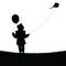 Child with balloon and flying dragon silhouette