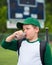 Child baseball player drinking chocolate milk