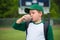 Child baseball player drinking chocolate milk