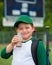 Child baseball player drinking chocolate milk