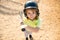 Child baseball player focused ready to bat. Kid holding a baseball bat.