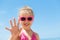 Child beach waving hand summer camp