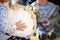 The child beats the tambourine. Child learning to play musical instruments