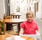 Child behind table