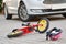 child bicycling helmet and bicycle near car during collision accident in the city