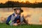 Child with binoculars travelling outdoors. Boy traveler with backpack in a summer day. Portrait of a little boy