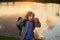 Child with binoculars travelling outdoors. Boy traveler with backpack in a summer day. Portrait of a little boy