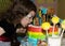 Child bite a rainbow cake