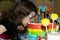 Child bite a rainbow cake