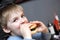 Child biting burger