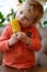 Child biting corn