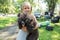Child blond girl lovingly embraces his pet Poodle dog. Friendship.