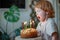 Child blowing out candles on a birthday cake