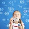 Child blowing soap bubbles