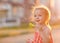 Child blows soap bubbles in setting sun. children`s day