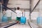 Child with blue baggage suitcase on escalator