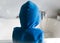 Child in blue bathrobe hooded seen  fron mehind