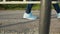 Child in blue sneakers and denim pants walking outdoor