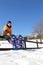 Child with blue snowshoes in the mountains