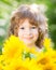Child with bouquet of beautiful sunflowers