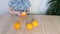 Child, boy 6-8 years old peels big orange oranges, the concept of the development of fine motor skills, patience, healthy food,