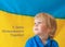 Child boy on the background of the yellow-blue Ukrainian flag