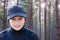 Child boy backlight portrait pine forest