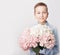 Child boy with bouquet of flowers. Mother`s Day Greeting Card. Happy mothers day frame background. Spring card template. Happy