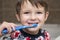 Child boy brushing teeth. Little boy in bathroom.