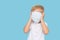 Child boy covered his face with a protective mask. The concept of strengthening quarantine during the coronavirus pandemic. Fake