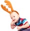 The child, the boy, with deer horns for a New Year\'s masquerade