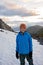 Child, boy, enjoying snow on mount Hoven, splendid view over Nordfjord from Loen skylift