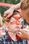 Child boy face painting, making tiger eyes process