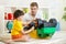 Child boy and father repair toy car