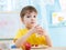 Child boy with a glass of fresh milk